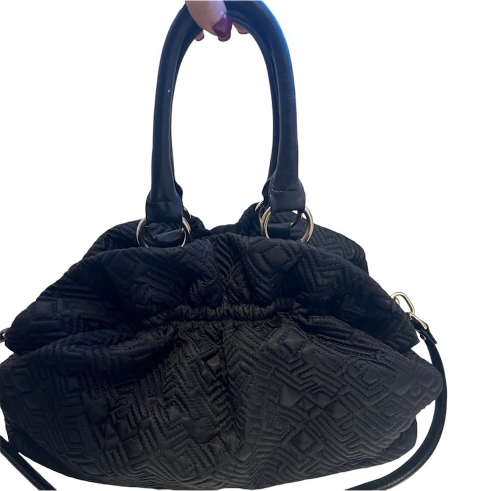 The limited small pouch bag. Beige inside w pocket. This purse looks brand new